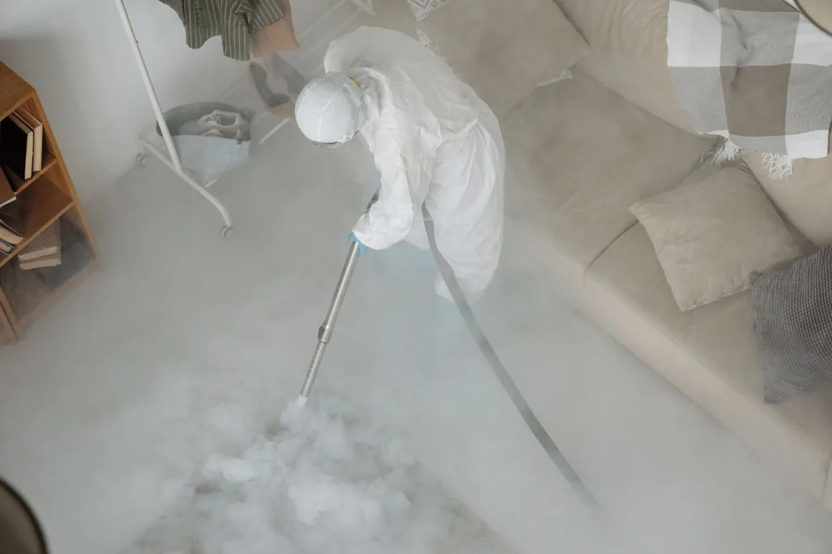 Biohazard cleanup technician in protective equipment, Dardanelle, AR